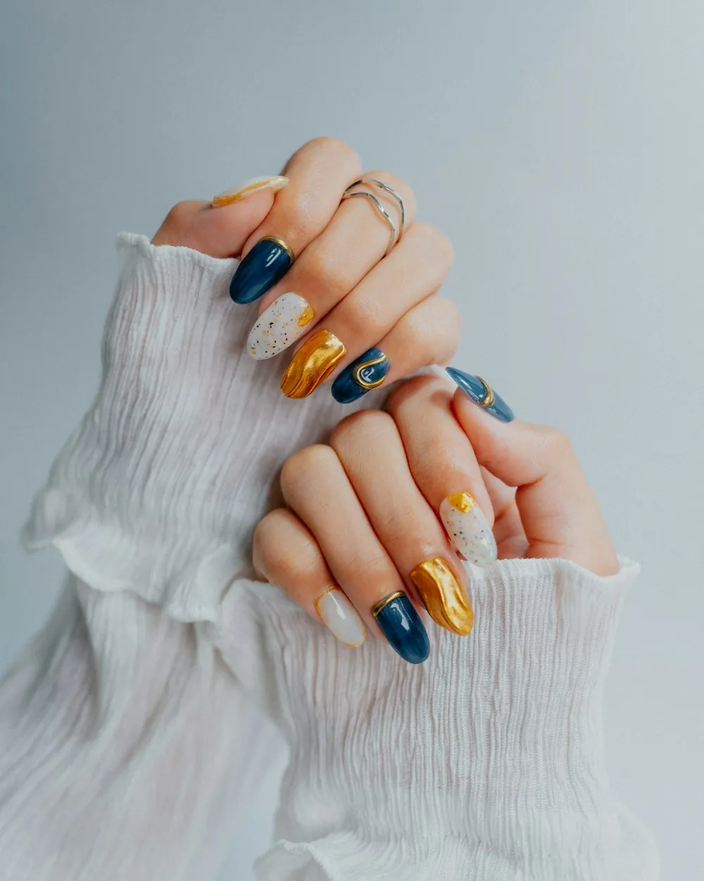 Navy, gold and white nail art