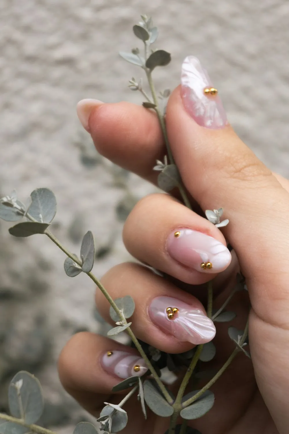 Ornate nail art with gold details